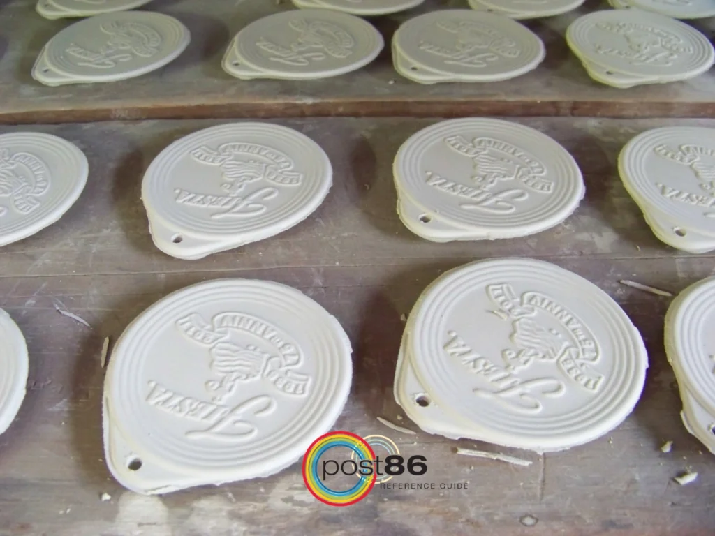 Bisque 75th Anniversary Ornaments on Rack in Factory - Post 86 Reference Guide